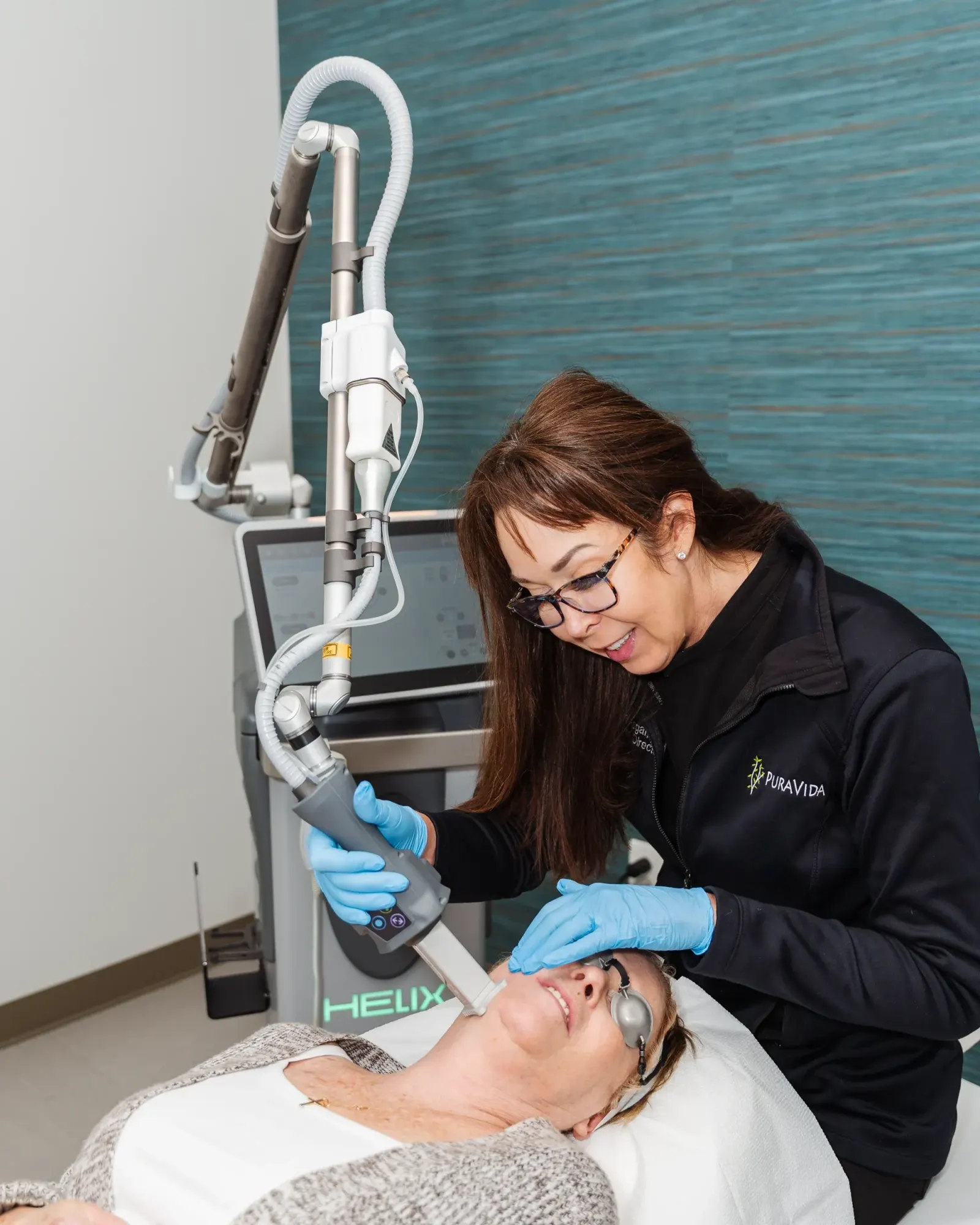 Pura Vida provider reviewing Tetra CO2 CoolPeel safety information with a patient