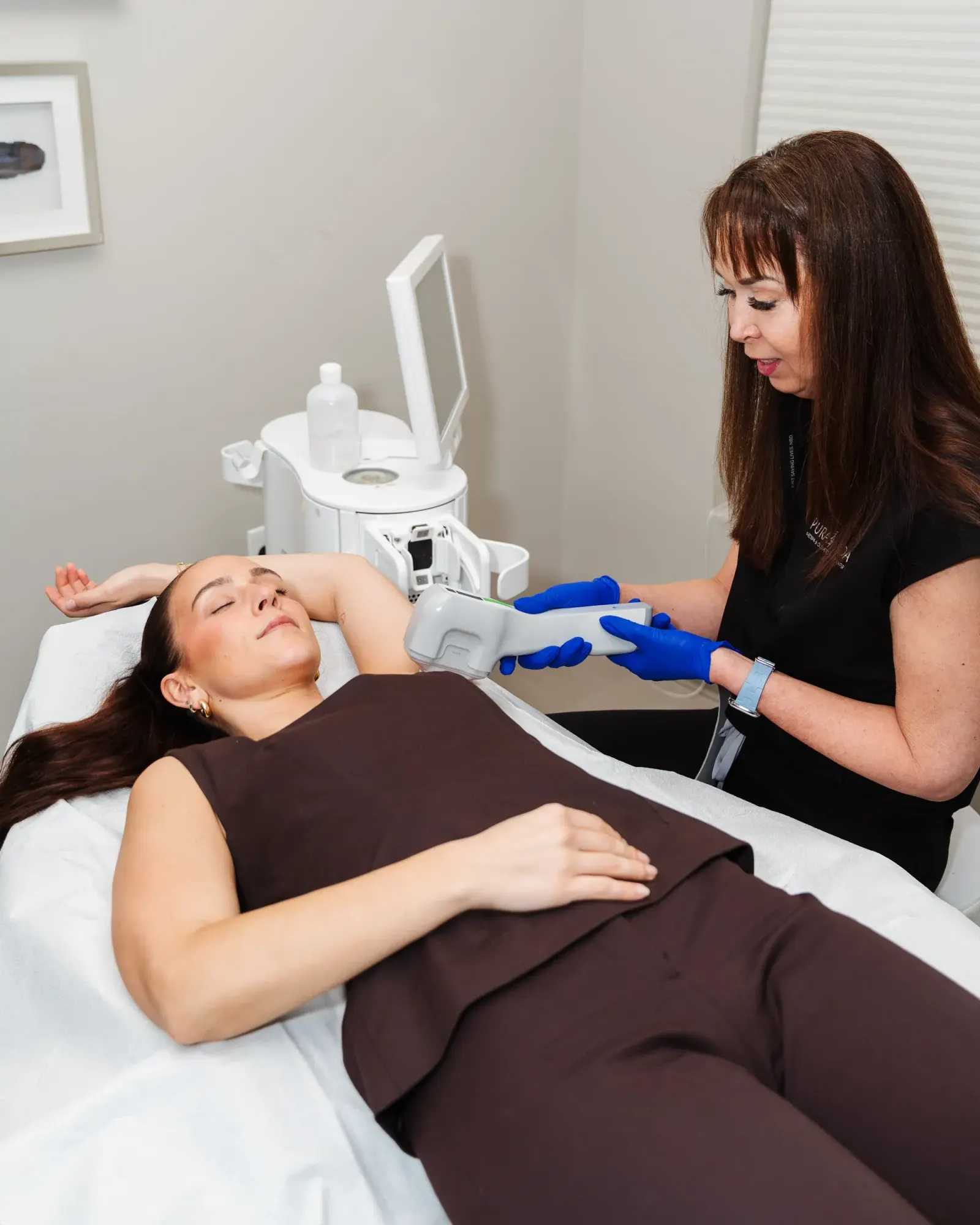Pura Vida provider reviewing MiraDry safety information with a patient