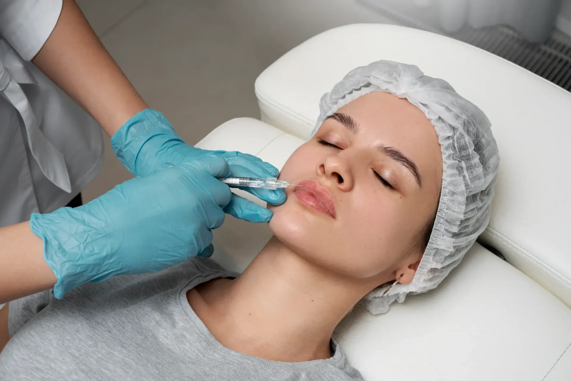 Patient receiving dermal filler treatment at Pura Vida Med Spa