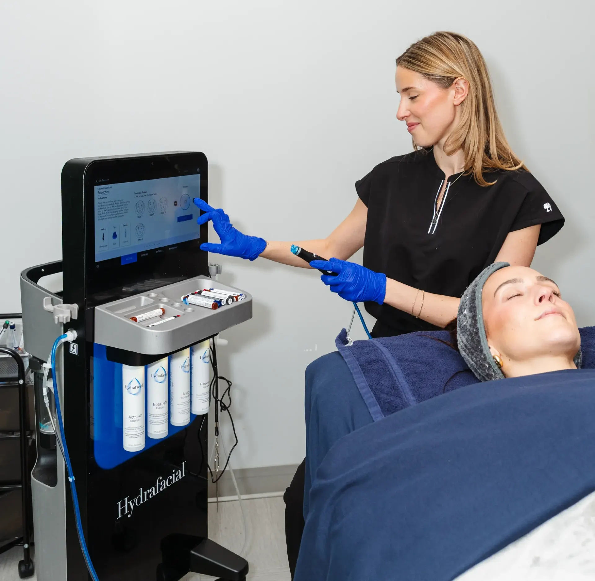 Woman receiving HydraFacial treatment at Pura Vida Med Spa in Fulton, MD