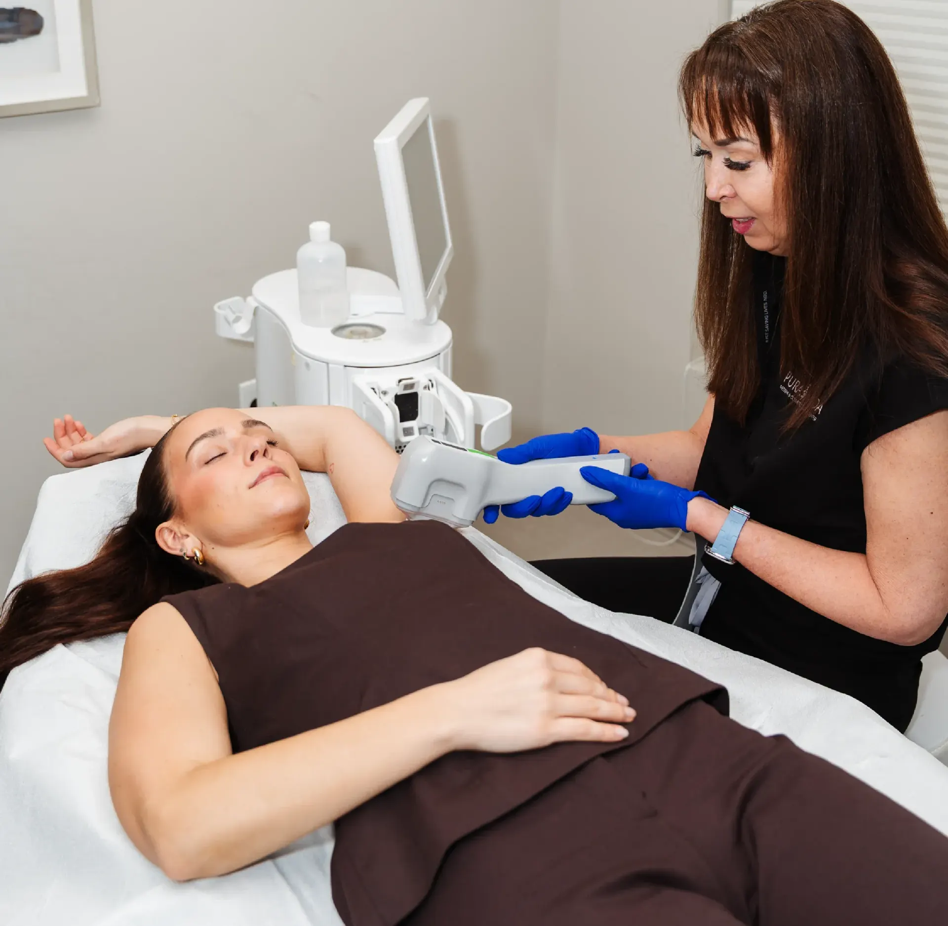 Refined woman receiving Motus AZ+ laser hair removal treatment at Pura Vida Med Spa in Maryland
