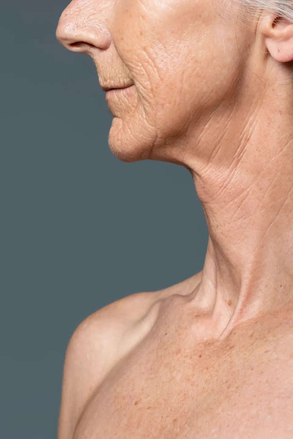 Side profile of senior woman showing neck and facial skin texture