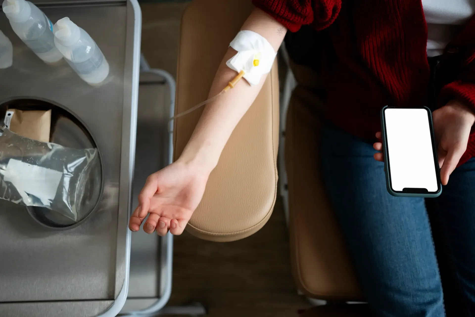 Patient receiving an Olympia Wellness IV drip in a relaxed treatment suite at Pura Vida Med Spa in Fulton, MD