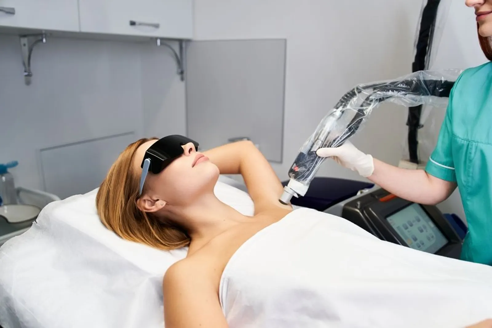 Pura Vida provider reviewing laser hair removal safety information with a patient