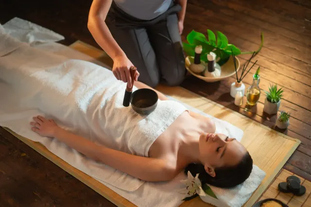 Guest resting during a private sound bath with crystal singing bowls at Pura Vida Med Spa in Fulton, MD